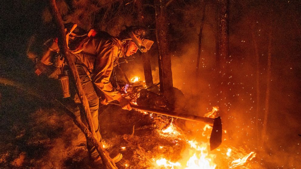 California cleans up from mudslides, as fire gains strength