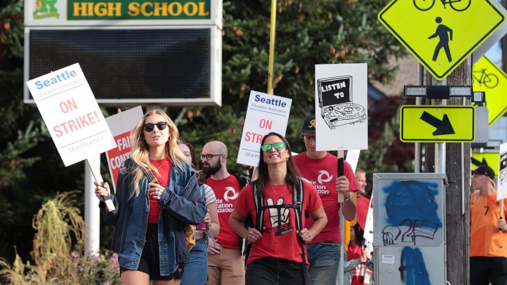 Teachers from Seattle Public Schools picket outside Roosevelt High School on what was supposed to be the first day of classes, Wednesday, Sept. 7, 2022, in Seattle. The first day of classes at Seattle Public Schools was cancelled and teachers are on 