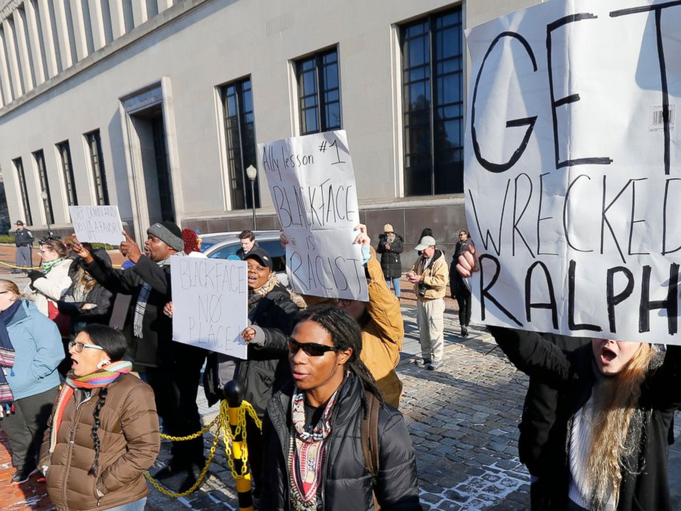 Demonstrators hold signs and chant outside the Governors office at the Capitol in Richmond, Va., Saturday, Feb. 2, 2019. The demonstrators are calling for the resignation of Virginia Governor Ralph Northam after a 30 year old photo of him on his medi