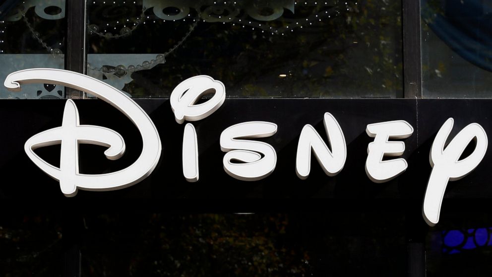 FILE - This Sept. 20, 2017, file photo shows a sign at the Disney store on the Champs Elysees Avenue in Paris, France. The Supreme Court’s decision to end the nation’s constitutional protections for abortion has catapulted businesses of all types int