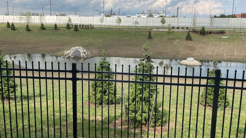 A retention pond at a stormwater park near the new Stellantis Detroit Assembly Complex on the city's eastside is shown June 30, 2021. The park is a greenspace reconfigured to filter rainwater runoff before it flows into sewer systems. (AP Photo/Corey