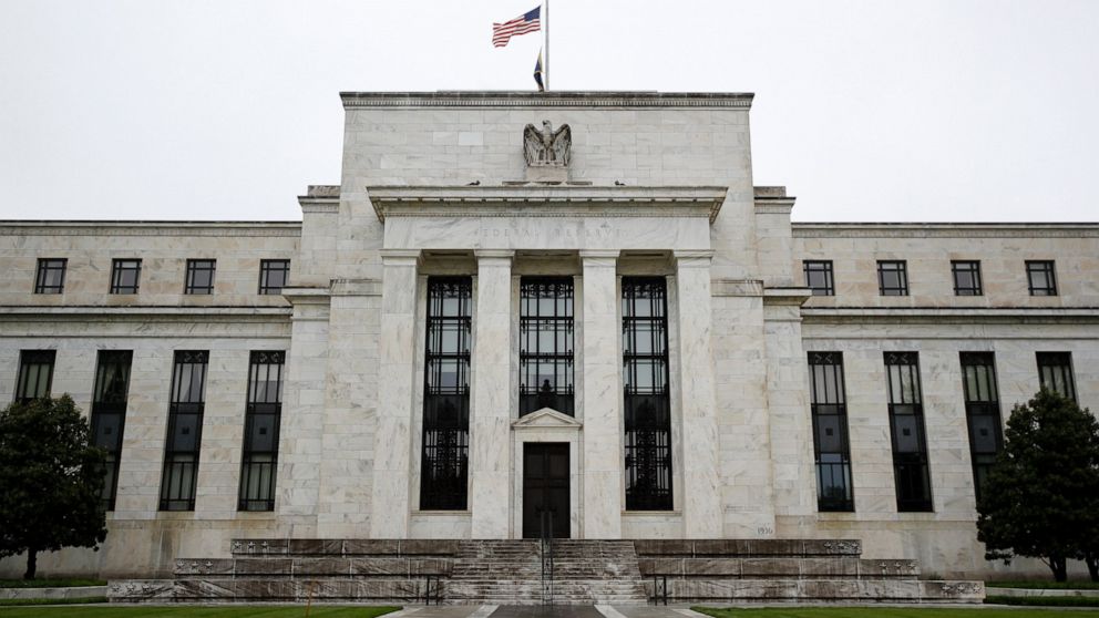 FILE - In this May 22, 2020, file photo, the Federal Reserve building is viewed in Washington. The Federal Reserve's Main Street lending program is off to a slow start. Banks are showing a surprising lack of interest in the program, while businesses 