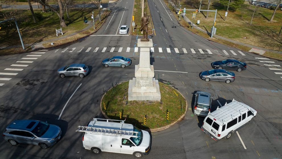Traffic drives in the circle at the monument of confederate General A.P. Hill, which contains his remains, is in the middle of a traffic circle on Arthur Ashe Blvd. Jan. 6, 2022, in Richmond, Va. Richmond officials are seeking a court order to move t