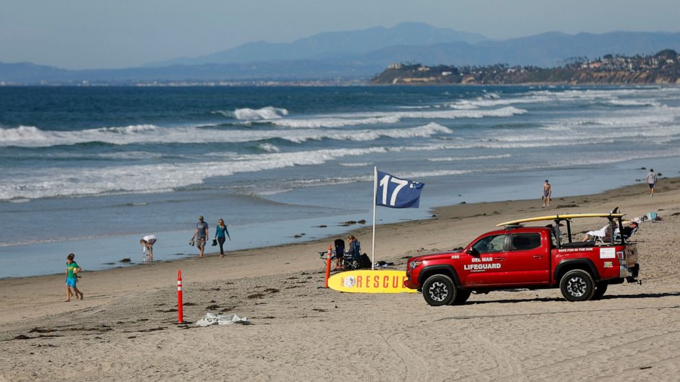 A lifeguard truck is seen on Nov. 4, 2022, along Del Mar beach, north of San Diego, after a 50-year-old woman was bitten by a shark in the water prompting a beach closure of at least 48 hours in the area, city lifeguard officials said on Friday, Nov.