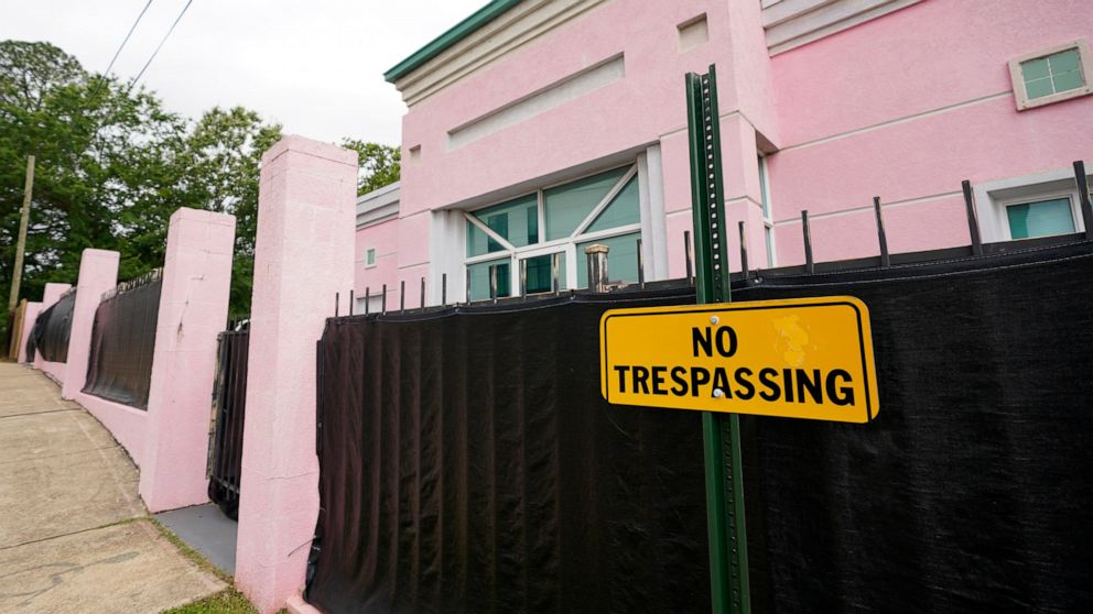 FILE - In this May 19, 2021, file photo, the Jackson Women's Health Organization clinic, more commonly known as "The Pink House," is shrouded with a black tarp so that its clients may enter in privacy in Jackson, Miss. The Mississippi attorney genera