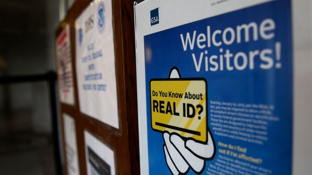 FILE - A sign at the federal courthouse in Tacoma, Wash., is shown on April 6, 2016, to inform visitors of the federal government's REAL ID Act, which requires state driver's licenses and ID cards to have security enhancements and be issued to people