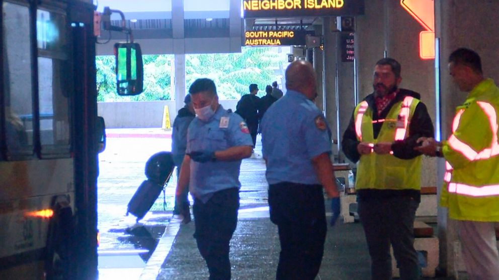 This image taken from video provided by Hawaii News Now shows the scene outside the international airport in Honolulu after nearly a dozen people were seriously injured when a flight to Hawaii hit severe turbulence on Sunday, Dec. 18, 2022. (Hawaii N