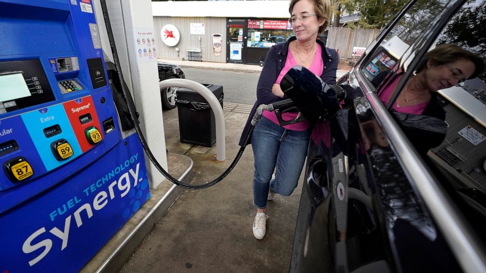 FILE - Jennifer Quinn fills her SUV at a gas station Monday, March 7, 2022, in Needham, Mass. The average price of regular gasoline nationwide is up slightly Wednesday, Sept. 21, from a day earlier, the first time prices have climbed in 99 days. (AP 