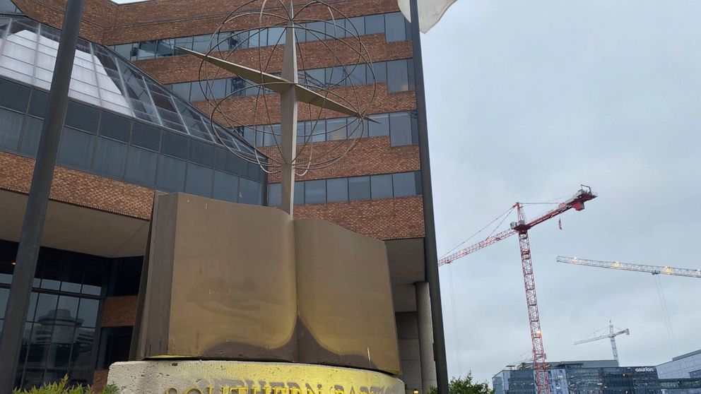 A cross and Bible sculpture stand outside the Southern Baptist Convention headquarters in Nashville, Tenn., on Tuesday, May 24, 2022. On Tuesday, top administrative leaders for the SBC, the largest Protestant denomination in America, said that they w