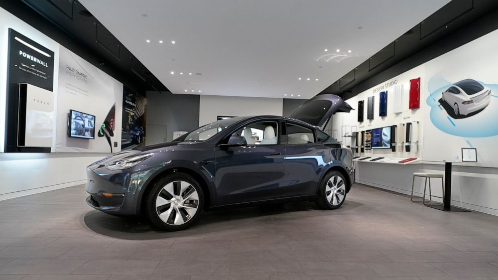 FILE - A Tesla Model Y Long Range is displayed on Feb. 24, 2021, at the Tesla Gallery in Troy, Mich. Tesla is recalling nearly 27,000 vehicles in the U.S. because the cabin heating systems may not defrost the windshield quickly enough. The latest in 