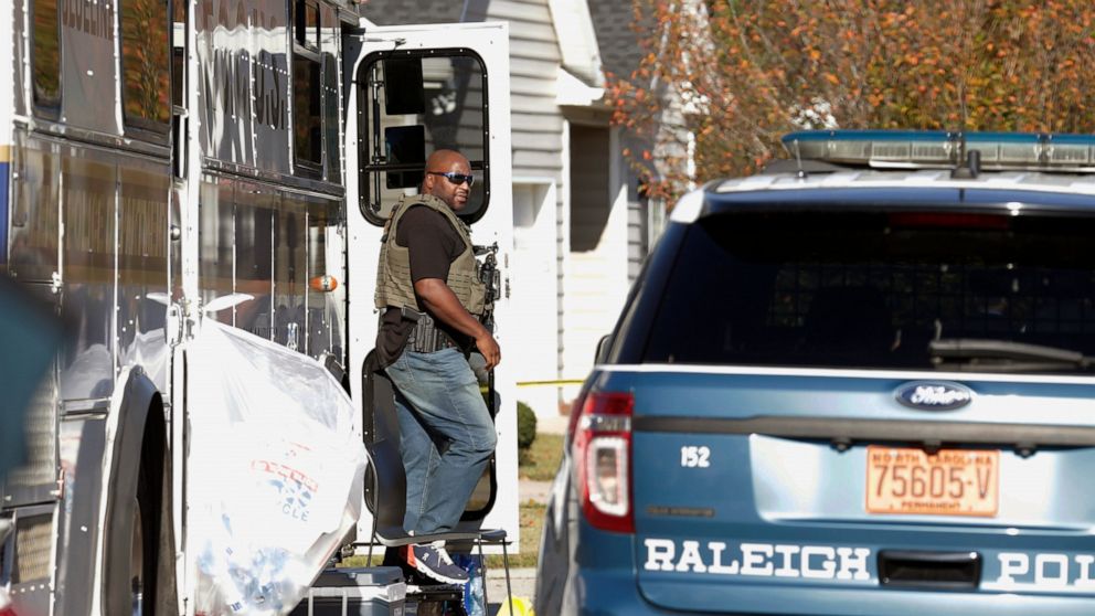 Police remain on the scene at Castle Pines Dr. and Sahalee Way following a shooting Thursday night in Raleigh, N.C., on Friday, Oct. 14, 2022. Police say a 15-year-old boy fatally shot at least two people in the streets of a neighborhood in North Car