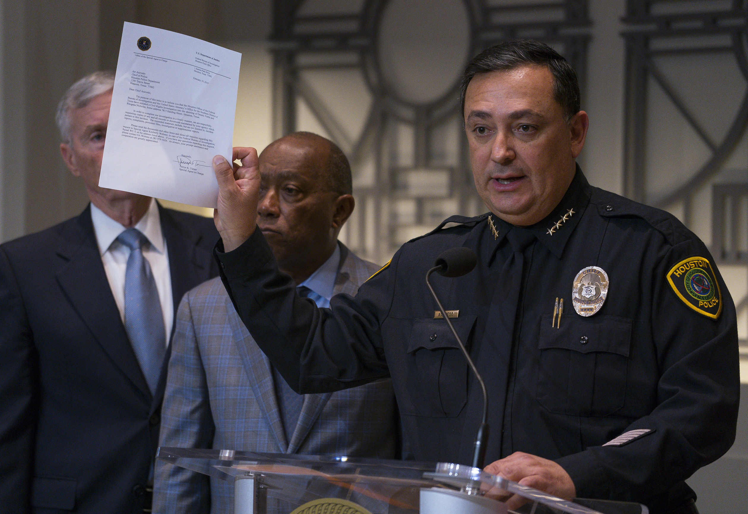 Houston Police Department Chief Art Acevedo holds up a letter from the FBI announcing the bureau's civil rights investigation related to the deaths of two people during the no-knock raid by narcotics officers that killed two people and injured five p
