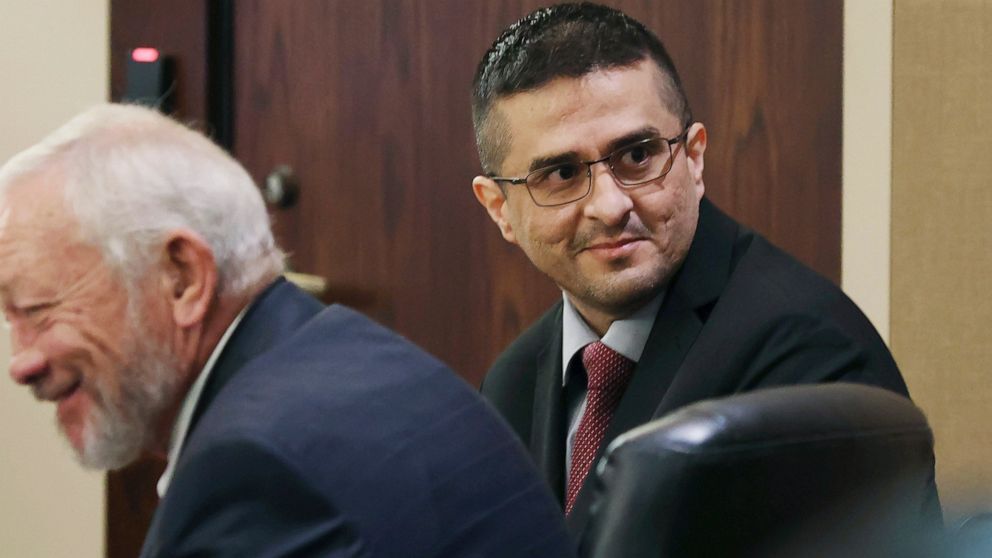 Capital murder defendant and former U.S. Border Patrol Juan David Ortiz looks around the courtroom before the start of the first day of the trial before Webb County State District Court Judge Oscar J. Hale, Monday, Nov. 28, 2022. Ortiz is charged in 