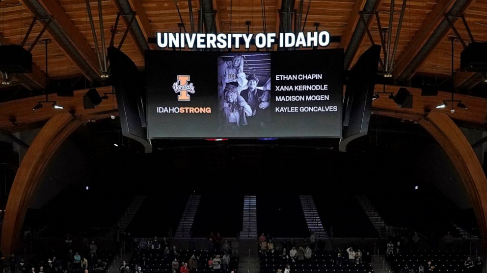 FILE - A photo and the names of four University of Idaho students who were killed over the weekend at a residence near campus are displayed during a moment of silence, Nov. 16, 2022, before an NCAA college basketball game in Moscow, Idaho. The Moscow