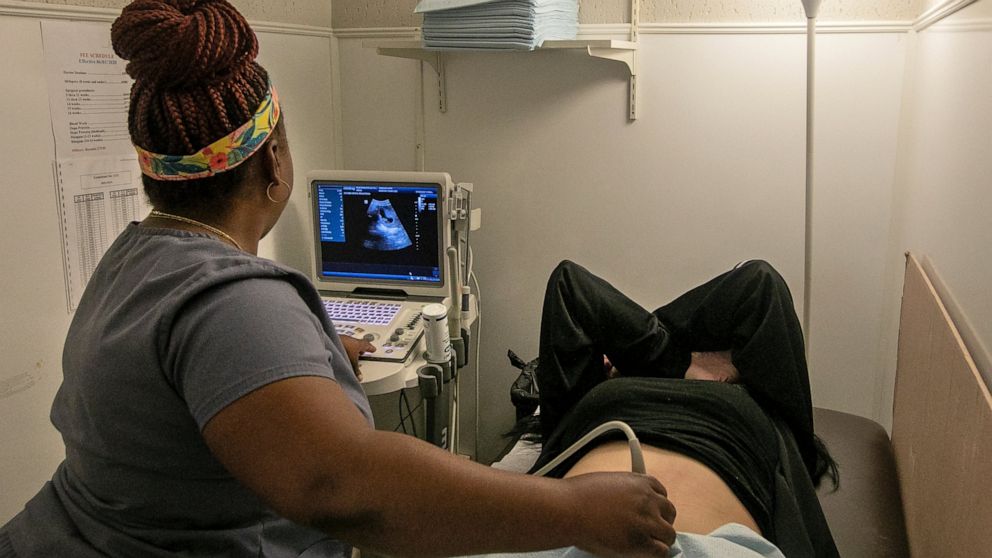 FILE - An operating room technician performs an ultrasound on a patient at Hope Medical Group for Women in Shreveport, La., on July 6, 2022. Abortion clinics in Louisiana have halted procedures after an appeals court ruled on Friday, July 26, 2022, t