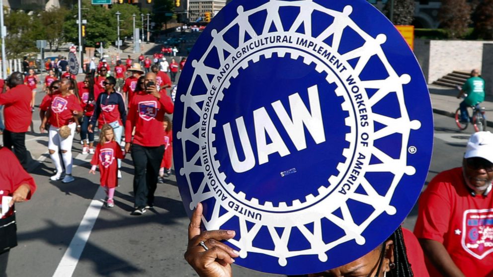 FILE - United Auto Workers members walk in the Labor Day parade in Detroit, Sept. 2, 2019. Members of the United Auto Workers union appeared on Thursday, Dec. 1, 2022, to favor replacing many of their current leaders in an election that stemmed from 