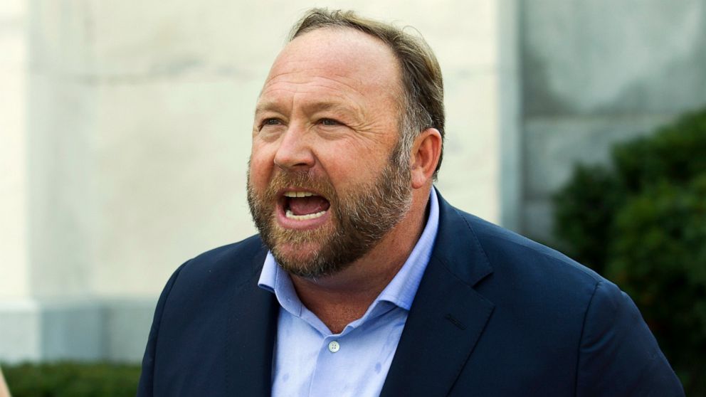 FILE - In this Sept. 5, 2018, file photo, Infowars host and conspiracy theorist Alex Jones speaks outside of the Dirksen building on Capitol Hill in Washington. A Connecticut judge has found Jones liable for damages in lawsuits brought by parents of 