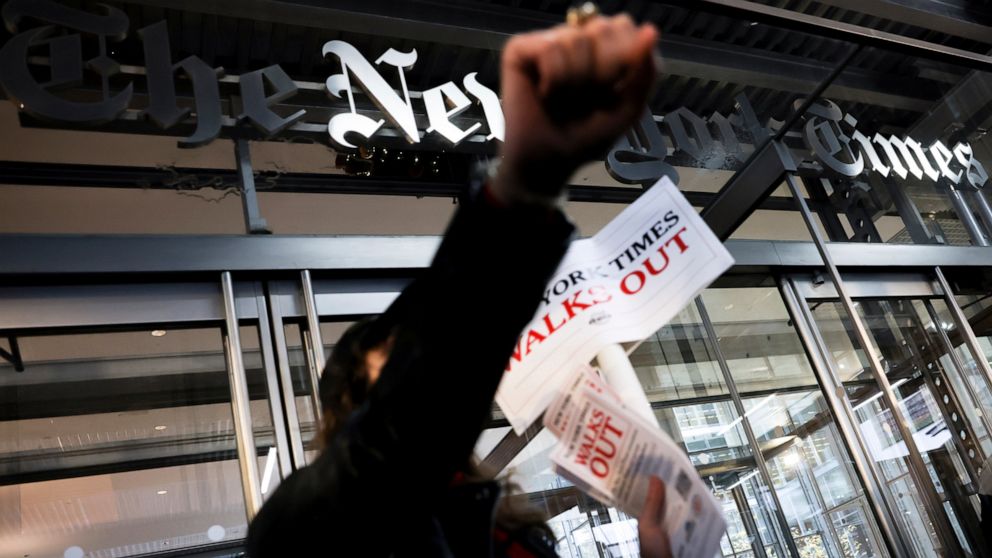 Hundreds of New York Times journalists and other staff protest outside the Times' office after walking off the job for 24 hours, frustrated by contract negotiations that have dragged on for months in the newspaper's biggest labor dispute in more than