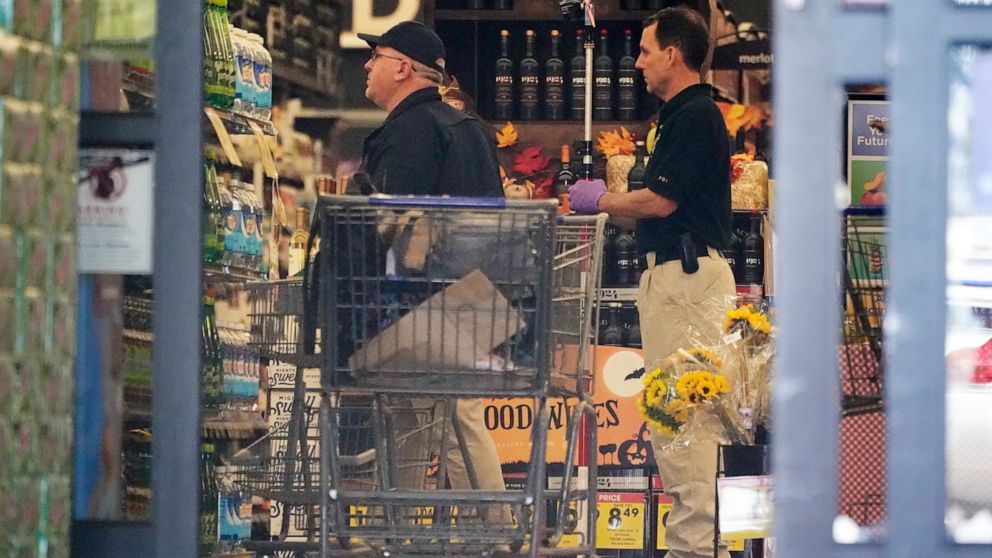 Investigators work inside a Kroger grocery store Friday, Sept. 24, 2021, in Collierville, Tenn. Police say a gunman, who has been identified as a third-party vendor to the store, attacked people Thursday and killed at least one person and wounded oth