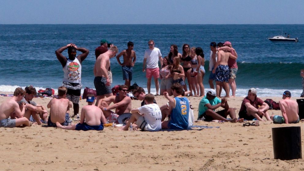 FILE - Beachgoers enjoy an afternoon on the sand in Point Pleasant Beach,N.J. on May 21, 2018. Judges issued rulings on Thursday, June 16, 2022 blocking so-called pop-up parties from being held in Long Branch and Point Pleasant Beach. (AP Photo/Wayne
