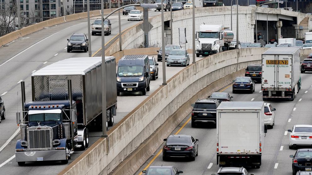 FILE - In this March 31, 2021 file photo, motor vehicle traffic moves along the Interstate 76 highway in Philadelphia. U.S. highway safety regulators have opened an investigation, Tuesday, July 20, into about a half-million semis with brakes that can