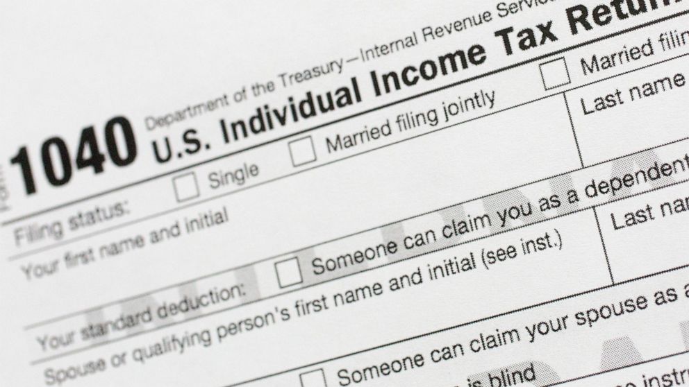 FILE - This July 24, 2018, file photo shows a portion of the 1040 U.S. Individual Income Tax Return form. The Trump administration is working on plans to delay the April 15 federal tax deadline for most individual taxpayers as well as small businesse