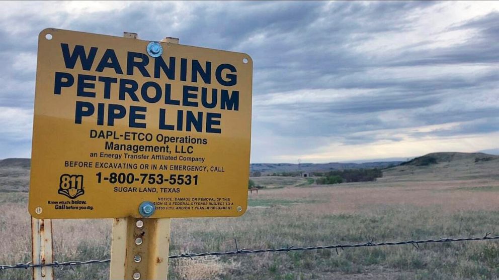 A sign for the Dakota Access Pipeline is seen north of Cannonball, N.D. and the Standing Rock Reservation on Thursday May 20, 2021. (AP Photo/Matthew Brown)