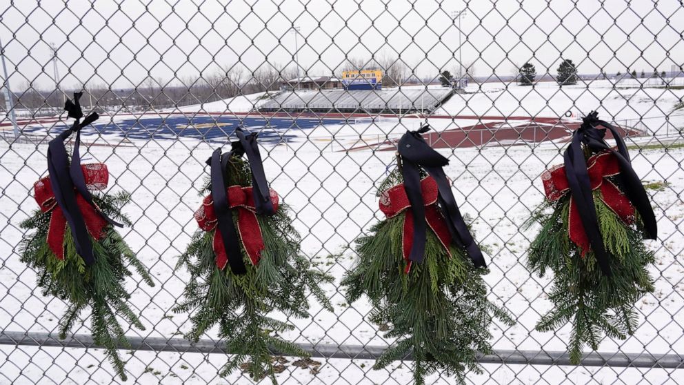 Wreaths with black bows are shown at Oxford High School in Oxford, Mich., Wednesday, Dec. 1, 2021. Authorities say a 15-year-old sophomore opened fire at Oxford High School, killing four students and wounding seven other people on Tuesday. (AP Photo/
