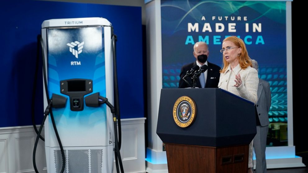President Joe Biden listens as Jane Hunter, CEO of Tritium, speaks about electric vehicle chargers during an event in the South Court Auditorium in the Eisenhower Executive Office Building on the White House complex, Tuesday, Feb. 8, 2022, in Washing