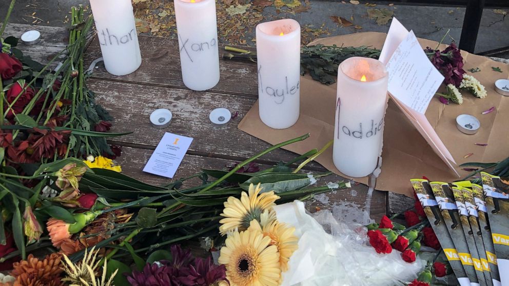 Candles and flowers are left at a make-shift memorial honoring four slain University of Idaho students outside the Mad Greek restaurant in downtown Moscow, Idaho, on Tuesday, Nov. 15, 2022. Police discovered the bodies of the four students at home ne