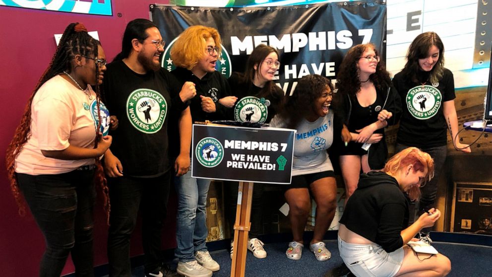 A group of fired Starbucks employees celebrate the result of a vote to unionize one of the coffee company's locations on Tuesday, June 7, 2022, in Memphis, Tenn. The so-called "Memphis Seven" jumped for joy, hugged each other and wept after a count h