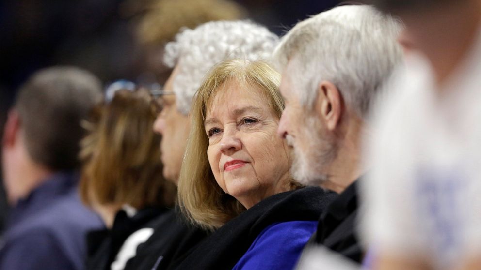 FILE - In this Nov. 17, 2019, file photo, St. Louis Mayor Lyda Krewson sits during an NCAA college basketball game between Saint Louis and Seton Hall in St. Louis. Krewson was elected on a pledge to address the violence that ravages her city. Amid th