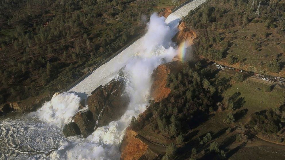 FILE - This Feb. 11, 2017, file aerial photo released by the California Department of Water Resources shows the damaged spillway with eroded hillside in Oroville, Calif. The Oroville Dam's spillways crumbled and fell away during heavy rains in Februa