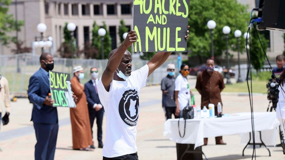 People demonstrate at the Minnesota State Capitol in St. Paul, Minn. on Friday, June 19, 2020, to mark Juneteenth, the day in 1865 when federal troops arrived in Galveston, Texas, to take control of the state and ensure all enslaved people be freed, 