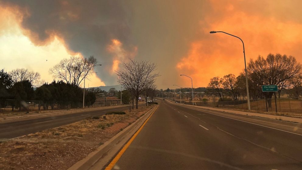 This photo provided by Renee Valdez shows plumes of smoke rising into the air, from wildfires in Las Vegas, N.M. on Monday, May 2, 2022. New Mexico was in the bull's eye for the nation's latest wave of hot, dry and windy weather. (Renee Valdez via The AP)