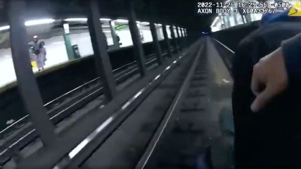 This image provided by NYPD shows police body cam video shows two New York City police officers and a bystander saving a man who fell on the tracks at a Manhattan subway station on Thursday, Nov. 24, 2022 in New York. The incident happened around 4 p