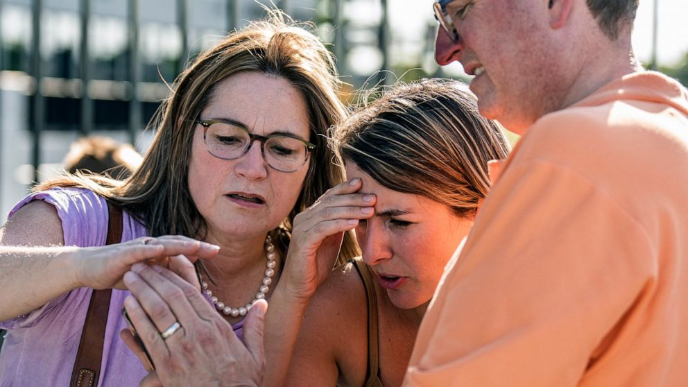 Karmen and Bart Swanson who are waiting for their son caught in a lockdown at the Mall of America share a video of the shooting with a fellow shopper in Bloomington, Minn., on Thursday, Aug. 4, 2022. Police in Minnesota confirm that gunshots were fir