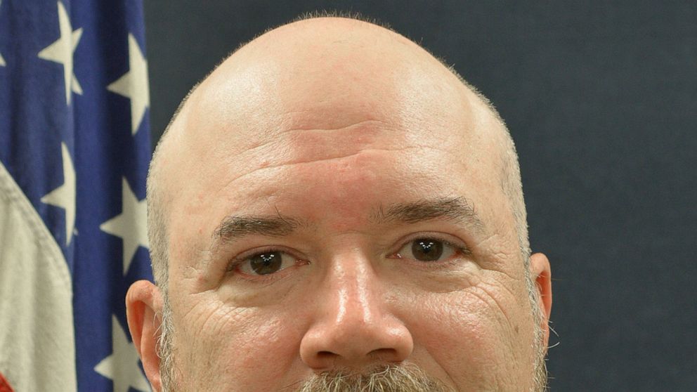 This 2018 photo provided by the Terre Haute Police Department shows Terre Haute Police Department Detective Greg Ferency. Investigators haven’t yet determined a motive for the ambush shooting of the police officer outside an FBI office in western Ind