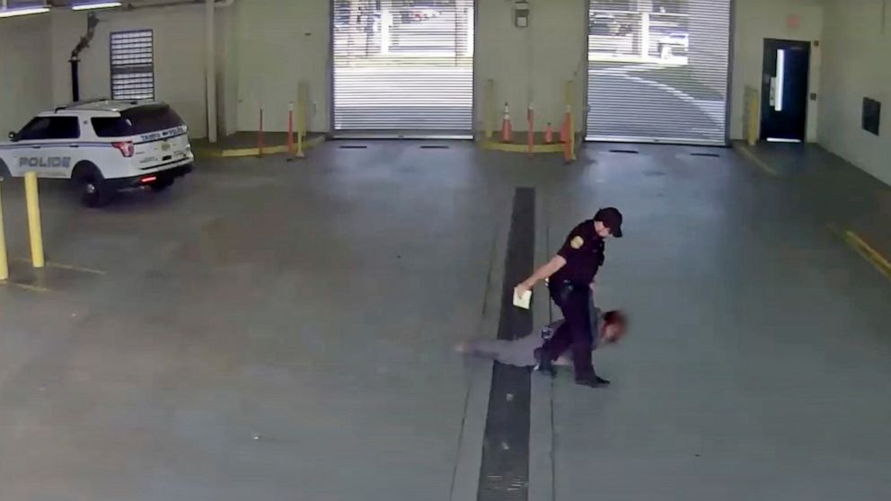 In this image taken from video released by the Tampa Police Department, police officer Gregory Damon drags a woman across the floor at Orient Road Jail in Tampa, Fla., on Nov. 17, 2022. Damon, who was videotaped dragging a handcuffed woman on the flo