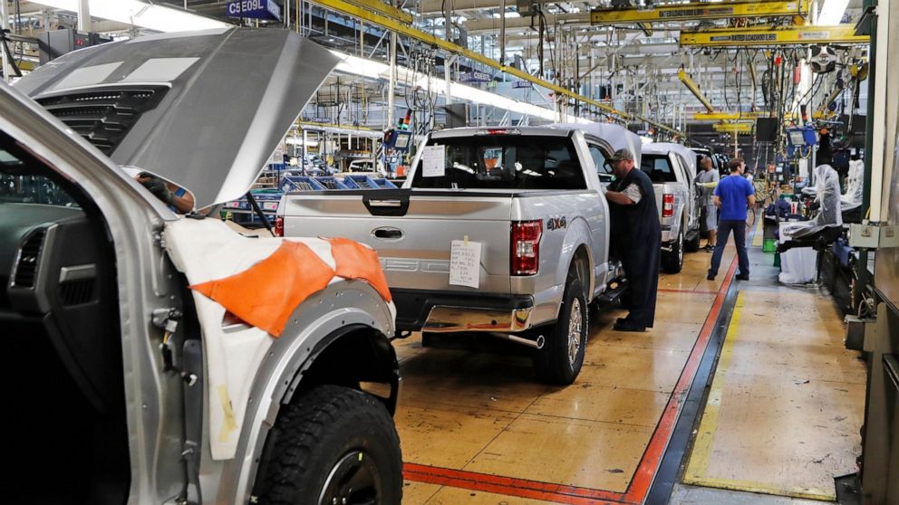 FILE - In this Sept. 27, 2018, file photo a United Auto Workers assemblymen work on a 2018 Ford F-150 trucks being assembled at the Ford Rouge assembly plant in Dearborn, Mich. The United Auto Workers union wants Detroit's three automakers to shut do