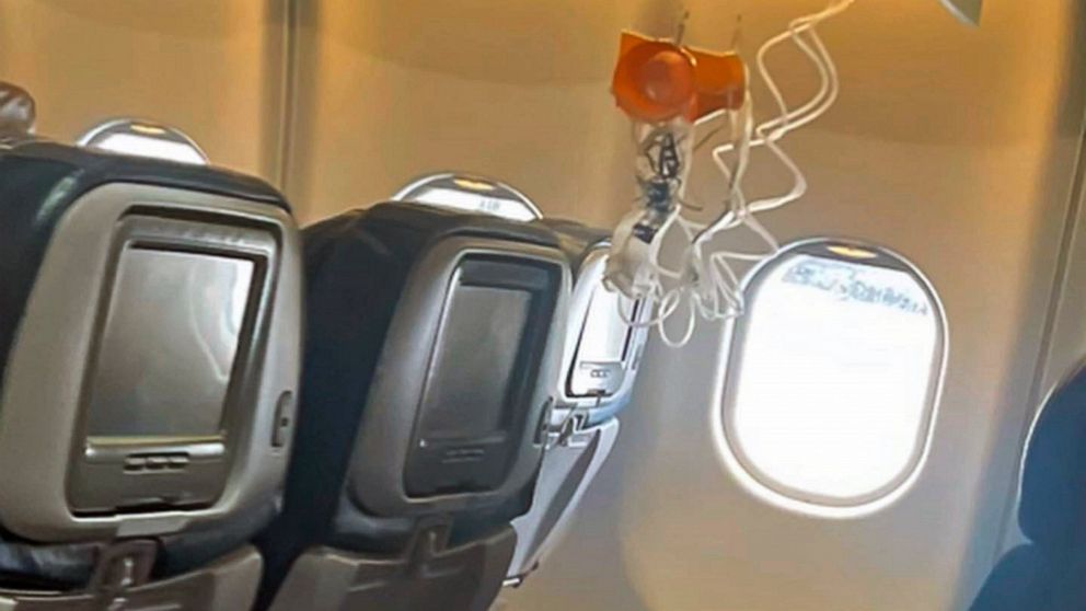 This mobile photo courtesy of passenger Jazmin Bitanga shows the interior of a Hawaiian Airlines plane on its flight from Phoenix to Honolulu, Sunday, Dec. 18, 2022, after severe turbulence rocked the flight. (Courtesy of Jazmin Bitanga via AP)