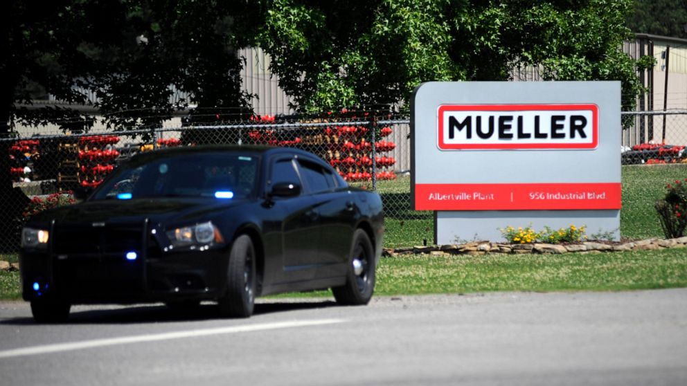 A police car guards the entrance to a Mueller Co. fire hydrant plant where police said multiple people were shot to death and others were wounded in Albertville, Ala., on Tuesday, June 15, 2021. (AP Photo/Jay Reeves)