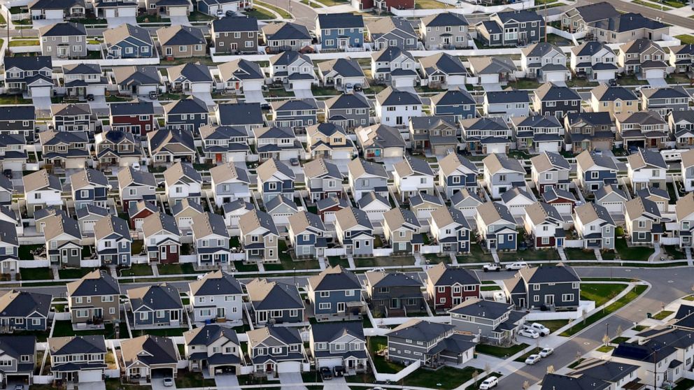 FILE - Rows of homes, are shown in suburban Salt Lake City, on April 13, 2019. Utah is one of two Western states known for rugged landscapes and wide-open spaces that are bucking the trend of sluggish U.S. population growth. The boom there and in Ida