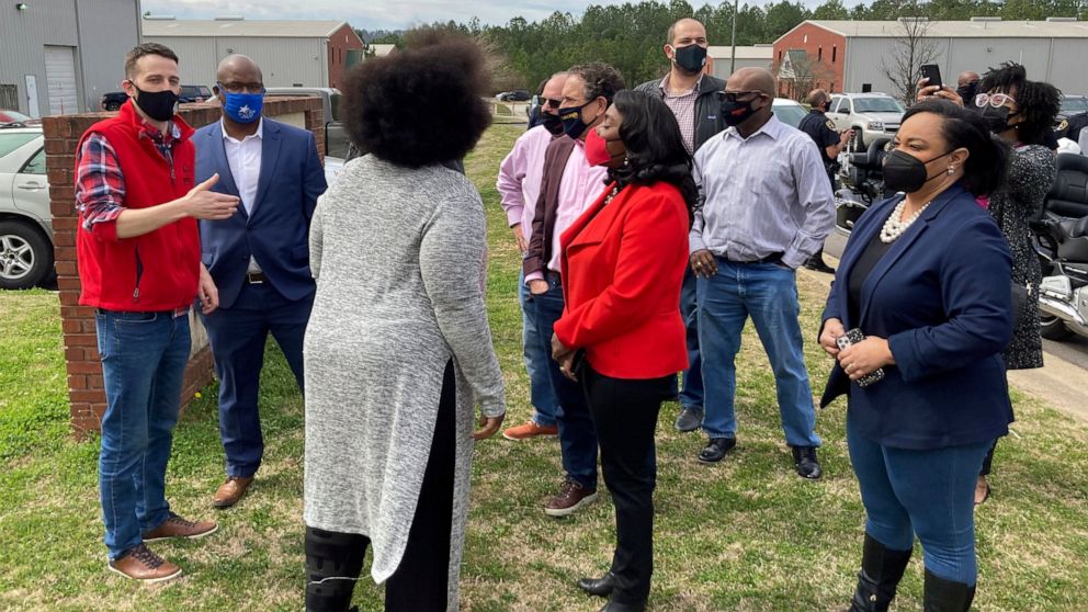 Rep. Terri Sewell, D-Ala, in the center wearing red, and Rep. Nikema Williams, D-Ga., at the far right, join fellow members of Congress, labor organizers and employees at an Amazon facility in Bessemer, Ala., on March 5, 2021. The nearly 6,000 worker