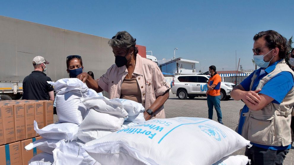 FILE - In this photo provided by the US Embassy in Turkey, Linda Thomas-Greenfield, U.S. Ambassador to the United Nations, examines aid materials at the Bab al-Hawa border crossing between Turkey and Syria, June 3, 2021. Supporters of a one-year exte