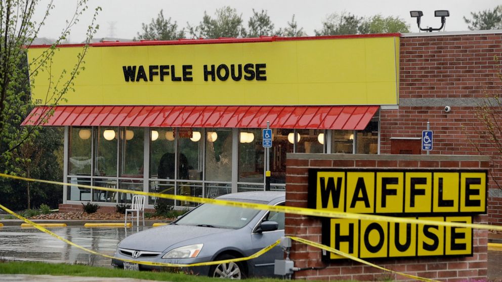 FILE - In this April 22, 2018, file photo, police tape blocks off a Waffle House restaurant in Nashville, Tenn., after a gunman opened fire at the restaurant. Attorneys who filed a lawsuit against the Waffle House in Tennessee after a deadly shooting