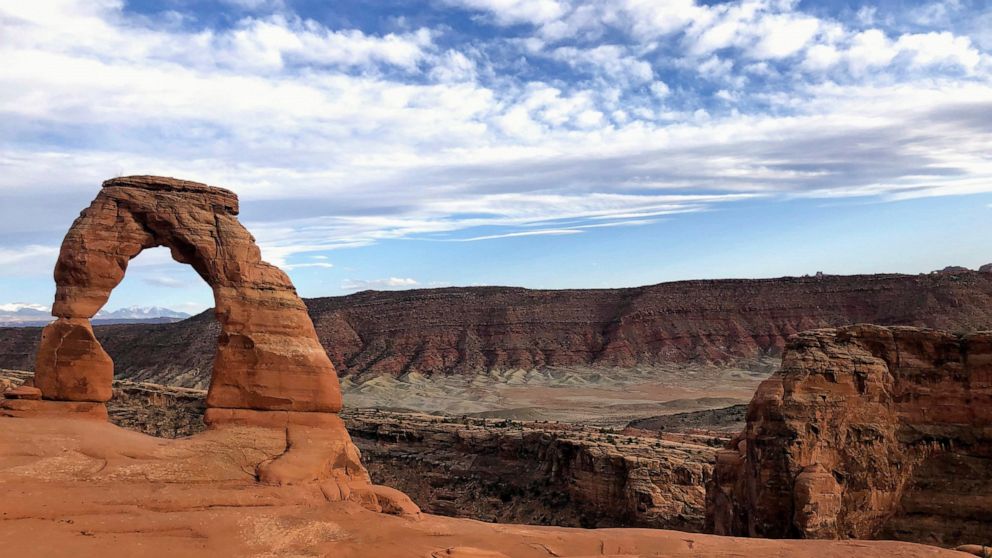 FILE - Delicate Arch is seen at Arches National Park on April 25, 2021, near Moab, Utah. Attorneys representing the family of a Ugandan activist who was killed by a swinging national park gate said Monday, Dec. 5, 2022, that they were pursuing $140 m