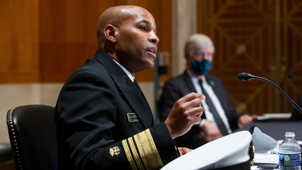 FILE - In this Sept. 9, 2020 file photo Surgeon General Jerome Adams, appears before a Senate Health, Education, Labor and Pensions Committee hearing on Capitol Hill, in Washington. Adams was cited for being in a closed Hawaii park in August while in