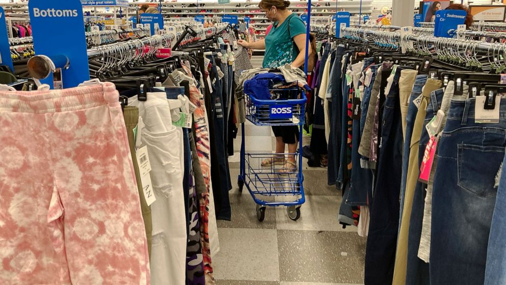 In this July 21, 2021 photo, a consumer shops at a retail store in Morton Grove, Ill. The fastest inflation in 40 years squeezed retailers during the first quarter, alarming investors worried about the broader economy's outlook. Earnings reports from