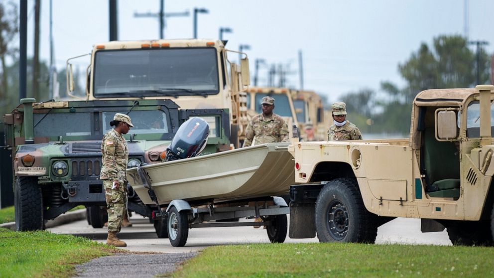 Dozens of boats trailered behind humvees are parked and ready to roll as Louisiana National Guardsmen gather in front of Jackson Barracks as the New Orleans area prepares for Hurricane Zeta on Wednesday, Oct. 28, 2020. (Chris Granger/The Times-Picayu
